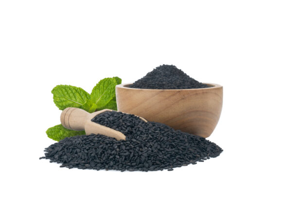 Black,sesame,seeds,and,wooden,spoon,isolated,on,white,background.organic